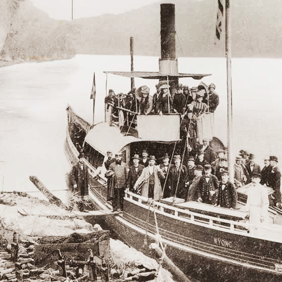 Old photo of a ship with many men